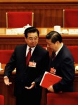 Chinese President Hu Jintao (L) talks with Vice President Xi Jinping as they leave after the closing session of the National People's Congress.