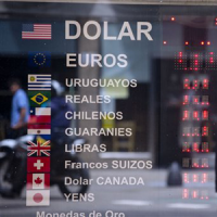 A sign shows no currency exchange numbers outside a money exchange house in Buenos Aires, Argentina.